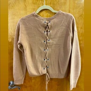 Nude pink sweater with lace-up back